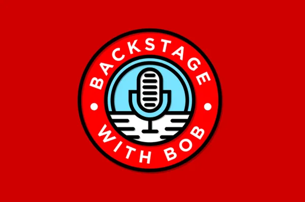 Round logo featuring a microphone with the text “Backstage with Bob”